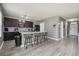Kitchen with island seating, stainless appliances, and modern lighting fixtures at 451 Hartford Heights St, Spring Hill, FL 34609