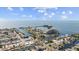 An aerial view features the waterfront condos, marina, and beautiful surrounding waterways at 6009 Sea Ranch Dr # 303, Hudson, FL 34667