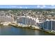 Beautiful aerial view of waterfront condo with a pool and a stunning view at 6009 Sea Ranch Dr # 303, Hudson, FL 34667