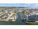 Aerial view showcasing waterfront condos with boat docks, beautiful landscaping, and canal access at 6009 Sea Ranch Dr # 303, Hudson, FL 34667