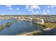 Picturesque aerial view of waterfront condo community surrounded by waterways and lush landscapes at 6009 Sea Ranch Dr # 303, Hudson, FL 34667