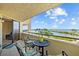 Relaxing balcony view with comfortable seating, overlooking lush greenery and scenic waterfront at 6009 Sea Ranch Dr # 303, Hudson, FL 34667