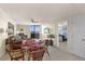 Dining area with seating for four, open to the living area and offering views at 6009 Sea Ranch Dr # 303, Hudson, FL 34667