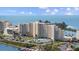 Beautiful waterfront high-rise condo building, showcasing lush landscaping and stunning ocean views at 6009 Sea Ranch Dr # 303, Hudson, FL 34667