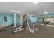 Spacious gym with weight machines and boxing equipment for a full-body workout at 6009 Sea Ranch Dr # 303, Hudson, FL 34667