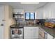 Well-equipped condo kitchen with stainless steel appliances and stylish backsplash at 6009 Sea Ranch Dr # 303, Hudson, FL 34667