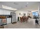 Bright open-concept living space with tile floors, dining area, and ocean views from the balcony at 6009 Sea Ranch Dr # 303, Hudson, FL 34667