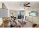 Comfortable living room with ceiling fan and sliding glass doors to balcony at 6009 Sea Ranch Dr # 303, Hudson, FL 34667