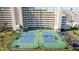 Beautiful tennis courts outside luxury condos, an invitation to enjoy an active community lifestyle at 6009 Sea Ranch Dr # 303, Hudson, FL 34667