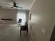 Living room featuring ceiling fans, large windows, and bare concrete flooring at 10814 Newbridge Dr, Riverview, FL 33579