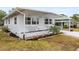 Charming home with updated windows, a covered entryway, and meticulously landscaped flower beds at 14912 Brookridge Blvd, Brooksville, FL 34613