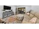 Comfortable living room with sliding glass doors, and stylish furnishings at 1725 Pine Ridge E Way # E, Palm Harbor, FL 34684