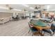Well-equipped recreation room featuring multiple tables, seating, and a kitchenette, perfect for social activities and gatherings at 1725 Pine Ridge E Way # E, Palm Harbor, FL 34684