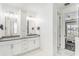 Elegant bathroom with double vanities, modern fixtures, and a sleek design at 6408 Key Island Ave, Apollo Beach, FL 33572