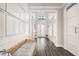 Bright hallway with white shiplap walls and stylish bench seating offers a welcoming entrance at 6408 Key Island Ave, Apollo Beach, FL 33572