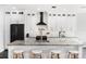 Kitchen with granite counters, sleek appliances, a breakfast bar, and ample cabinetry, offering both style and functionality at 6408 Key Island Ave, Apollo Beach, FL 33572