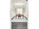Bright home office features custom built-ins, a stylish desk, and elegant lighting for a productive workspace at 6408 Key Island Ave, Apollo Beach, FL 33572