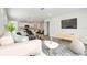 Bright, open-concept living room with modern furnishings and stylish decor at 6690 Michael Favor Way, Wesley Chapel, FL 33545
