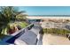 Outdoor kitchen with a built-in grill and ocean views for entertaining at 1350 Gulf Blvd, Clearwater, FL 33767