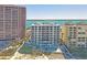 Aerial view of condo complex on the beach with a pool and ocean views at 1350 Gulf Blvd, Clearwater, FL 33767