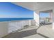 Expansive balcony featuring stunning ocean views and glass railings to maximize the view of the ocean and beach at 1350 Gulf Blvd, Clearwater, FL 33767