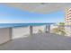 Balcony with ocean views and a beach, offering a serene outdoor living space at 1350 Gulf Blvd, Clearwater, FL 33767