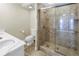 Well lit bathroom featuring a spacious shower and a toilet with a large, elegant vanity at 1350 Gulf Blvd, Clearwater, FL 33767