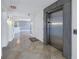 Building hallway with elevator leading into a bright and modern condominium at 1350 Gulf Blvd, Clearwater, FL 33767