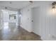 Building hallway leading into a bright condominium with tiled floor, and white trim at 1350 Gulf Blvd, Clearwater, FL 33767