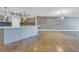 Stylish kitchen with breakfast bar, pendant lights, and an adjacent living area at 1350 Gulf Blvd, Clearwater, FL 33767