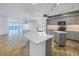 Modern kitchen with stone countertops, custom cabinets, and an open floorplan with ocean views at 1350 Gulf Blvd, Clearwater, FL 33767