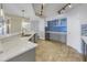 Modern kitchen with white quartz countertop, stainless steel appliances, and stylish backsplash at 1350 Gulf Blvd, Clearwater, FL 33767