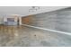 Open living space with stone floors and accent wall at 1350 Gulf Blvd, Clearwater, FL 33767