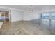 Open living room with tile flooring and white walls, perfect for entertaining at 1350 Gulf Blvd, Clearwater, FL 33767