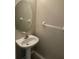 Powder room features a pedestal sink and a large decorative mirror at 14215 Waterville Cir, Tampa, FL 33626