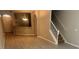 Open-concept living room boasts modern flooring and staircase access to the second floor at 14215 Waterville Cir, Tampa, FL 33626