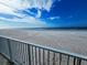 Stunning beach view from the property, featuring a sandy shore and clear ocean waters at 18650 Gulf Blvd # 413, Indian Shores, FL 33785