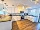 Updated kitchen features white cabinets, granite countertops, stainless steel appliances, and modern tile backsplash at 18650 Gulf Blvd # 413, Indian Shores, FL 33785
