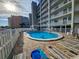Community outdoor pool surrounded by lounge chairs, offering a relaxing space for residents to unwind and enjoy the sun at 18650 Gulf Blvd # 413, Indian Shores, FL 33785