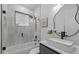 Bright bathroom with a shower-tub combination and modern black hardware at 1905 W Erna Dr, Tampa, FL 33603