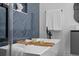 Luxurious bathtub with modern fixtures and stylish blue tile backsplash at 1905 W Erna Dr, Tampa, FL 33603