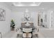 Dining room with stylish lighting, modern artwork, and seating for eight at 1905 W Erna Dr, Tampa, FL 33603