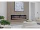 Contemporary fireplace with decorative wood paneling and a modern art piece above at 1905 W Erna Dr, Tampa, FL 33603