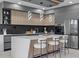 Modern kitchen with sleek cabinetry, stainless steel appliances, and a stylish island with seating at 1905 W Erna Dr, Tampa, FL 33603