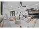 Bright and airy open-concept living room featuring modern design elements and seamless flow to the kitchen area at 1905 W Erna Dr, Tampa, FL 33603