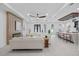Spacious open-concept living area with a modern fireplace, stylish seating, and a bar area perfect for entertaining at 1905 W Erna Dr, Tampa, FL 33603