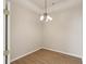 Dining room with hardwood floors and light fixture at 31447 Shaker Cir, Wesley Chapel, FL 33543