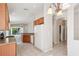 Bright kitchen featuring wood cabinets, tile floors, and a view to the backyard at 31447 Shaker Cir, Wesley Chapel, FL 33543