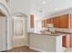 Bright kitchen with wood cabinets, white appliances, and an eat-in counter area at 31447 Shaker Cir, Wesley Chapel, FL 33543