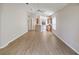 Bright living room showcases new floors, neutral walls and an open floorplan to the kitchen at 31447 Shaker Cir, Wesley Chapel, FL 33543